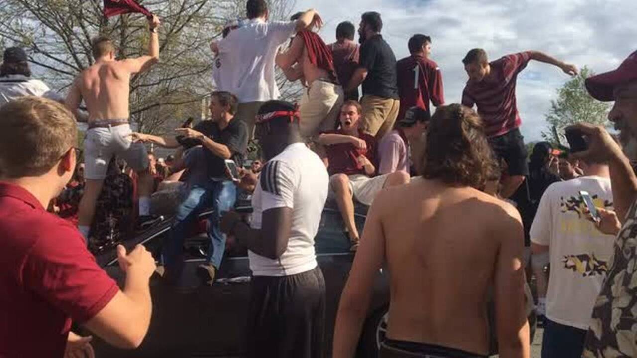 Students overtake car after South Carolina basketball advances to the final four