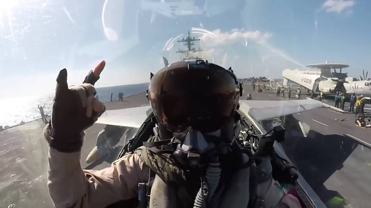 F/A-18s launch and refuel, mid-air