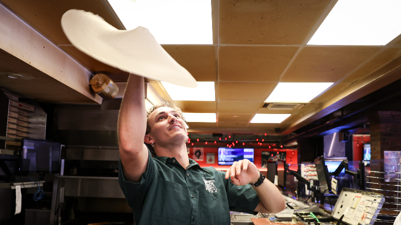 Why has Woodstocks been the SLO pizza favorite for decades?