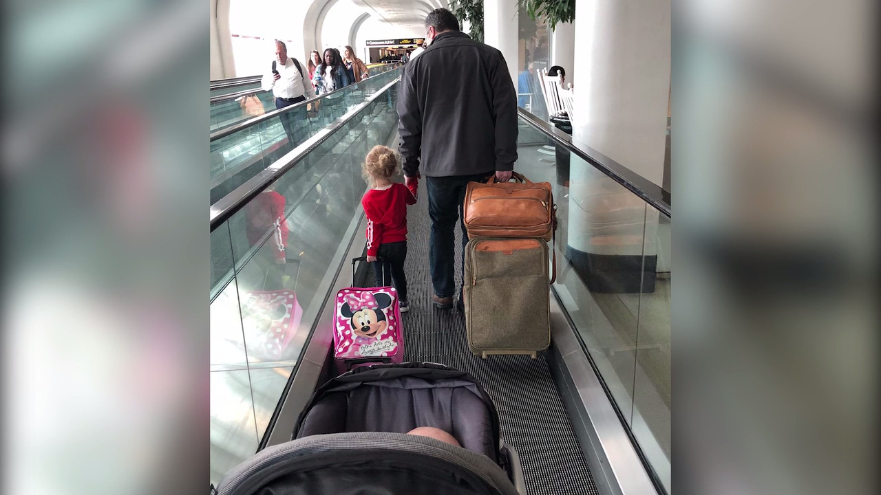 A kind stranger helped her with her upset kids on the plane. She found him in Kansas