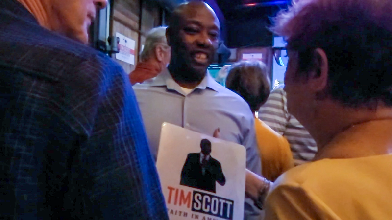 GOP hopeful SC Sen. Tim Scott makes his way through Bluffton crowd, stops for selfie