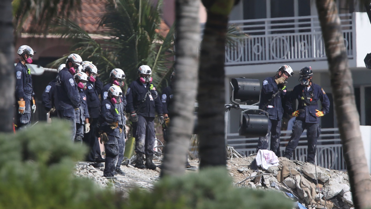 Death toll at 22 as mayor signs demo order, Surfside search crews eye Hurricane Elsa