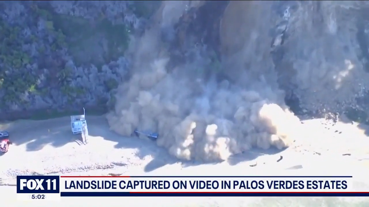 Cliff collapses onto California beach in a massive roar of dust and rocks, video shows