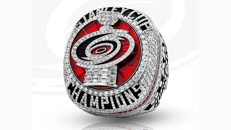 The Carolina Hurricanes show off their massive Stanley Cup Championship rings