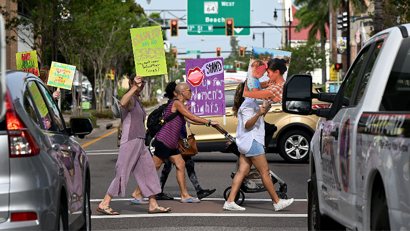 Benefield supporters march in Bradenton ahead of murder trial