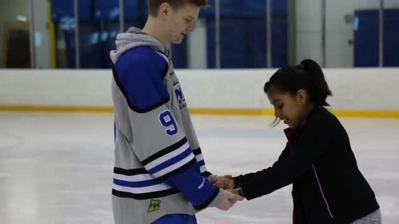 Wichita middle-schoolers learn hockey from the pros