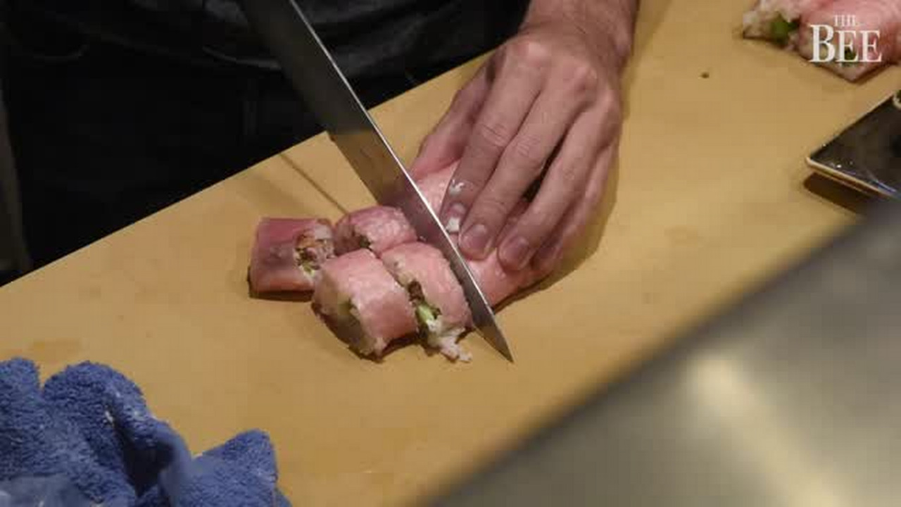 Elk Grove’s Kyle Larson prepares sushi at Miknuni on visit to Northern California