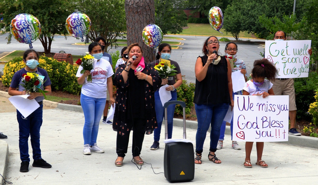 Parishioners gather to pray for, serenade friars quarantined due to COVID-19
