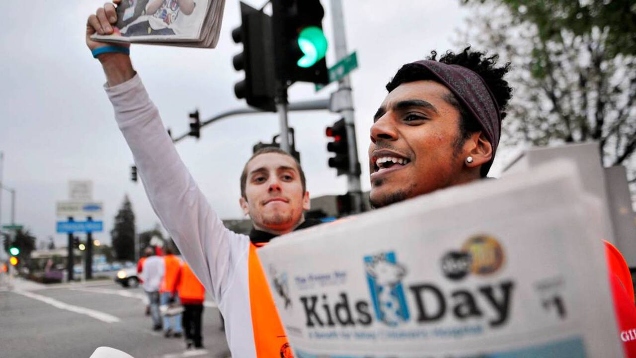 Volunteers hit the streets to sell Kids Day newspapers