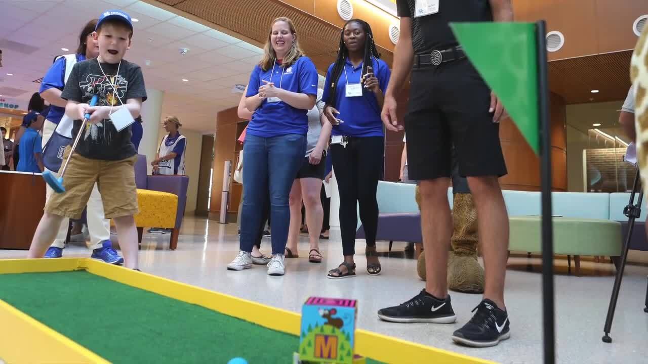Photo slideshow: UK football team and PGA Tour pros visit Kentucky Children’s Hospital