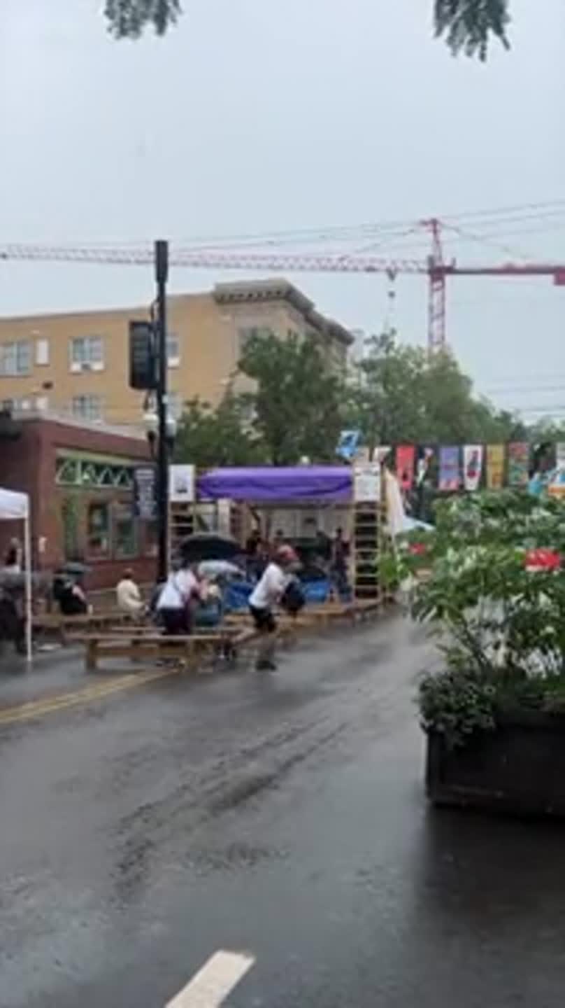 A storm passes through State College during Arts Fest
