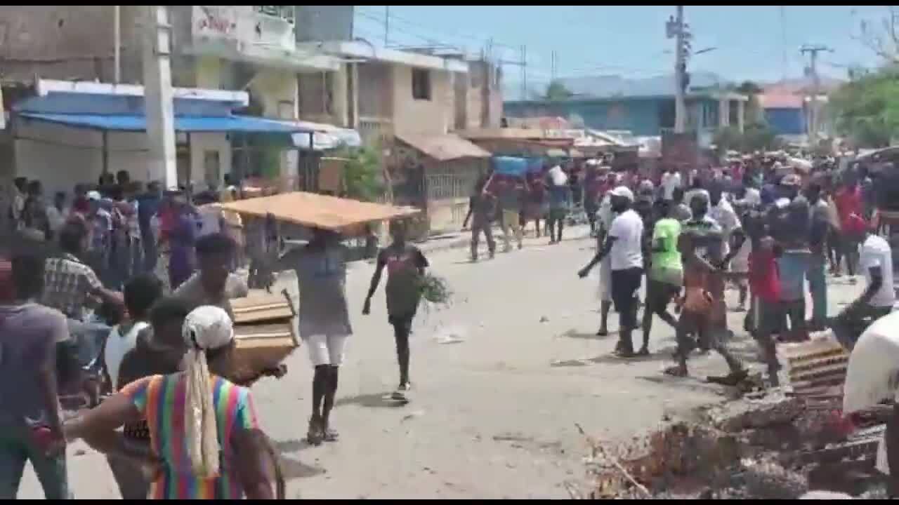 As protests, looting continue, a tropical storm may be zeroing in on Haiti