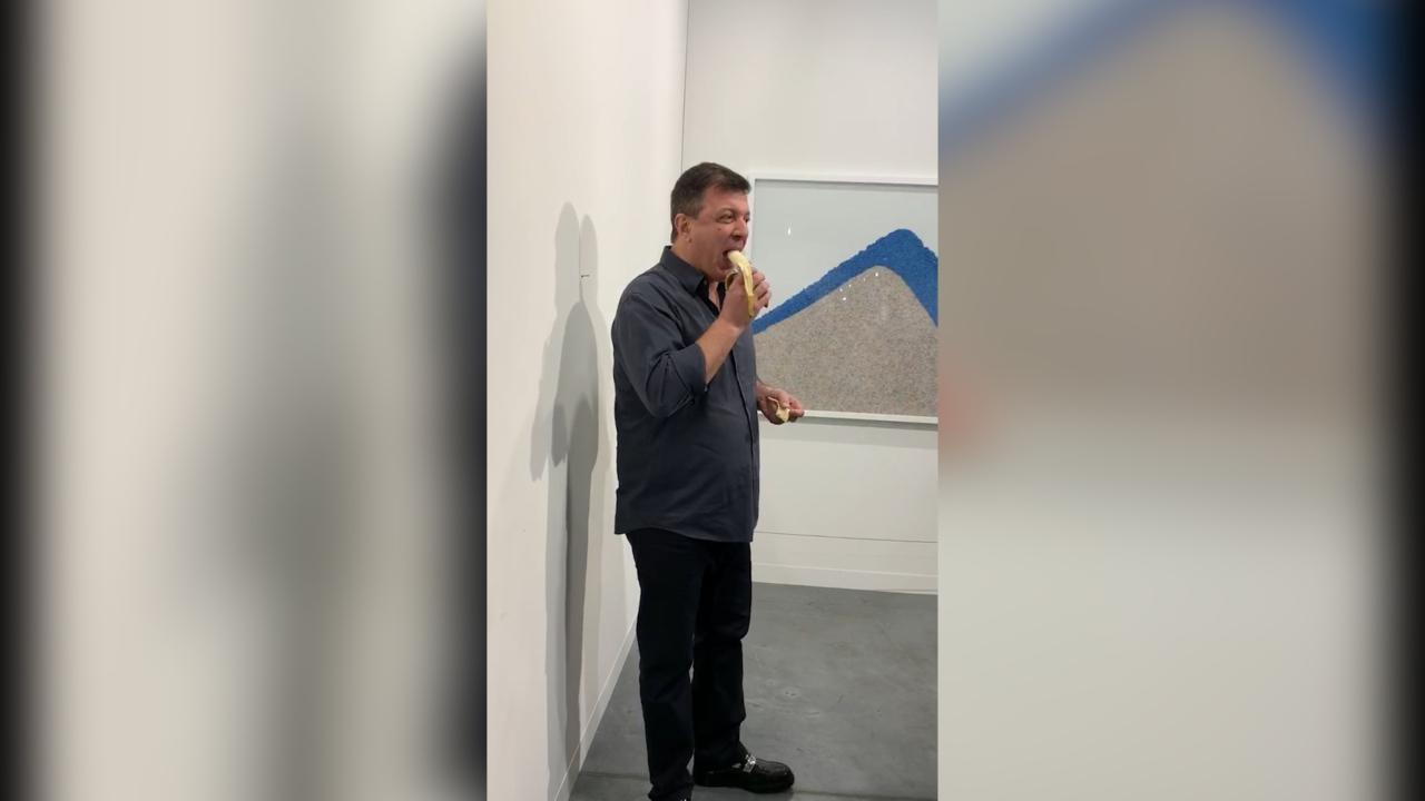Performance artist David Datuna eats the $120,000 banana