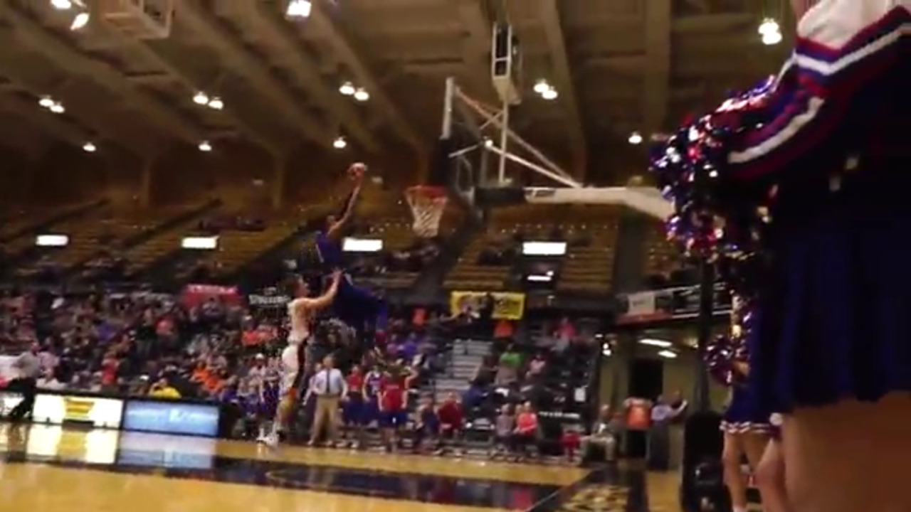Scary moment as player is shoved from behind on fast break dunk attempt