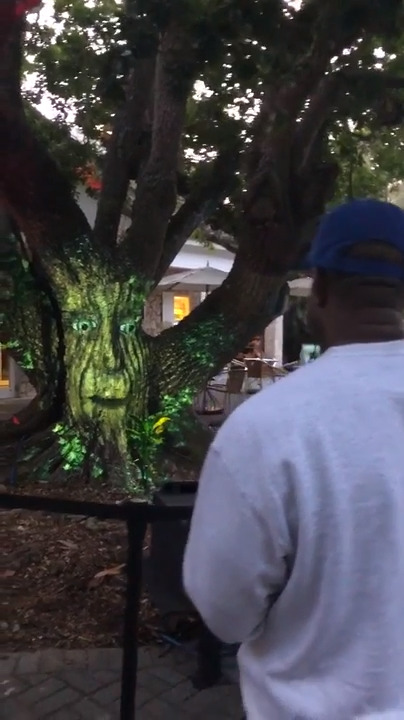 Kanye West beatboxes with a tree