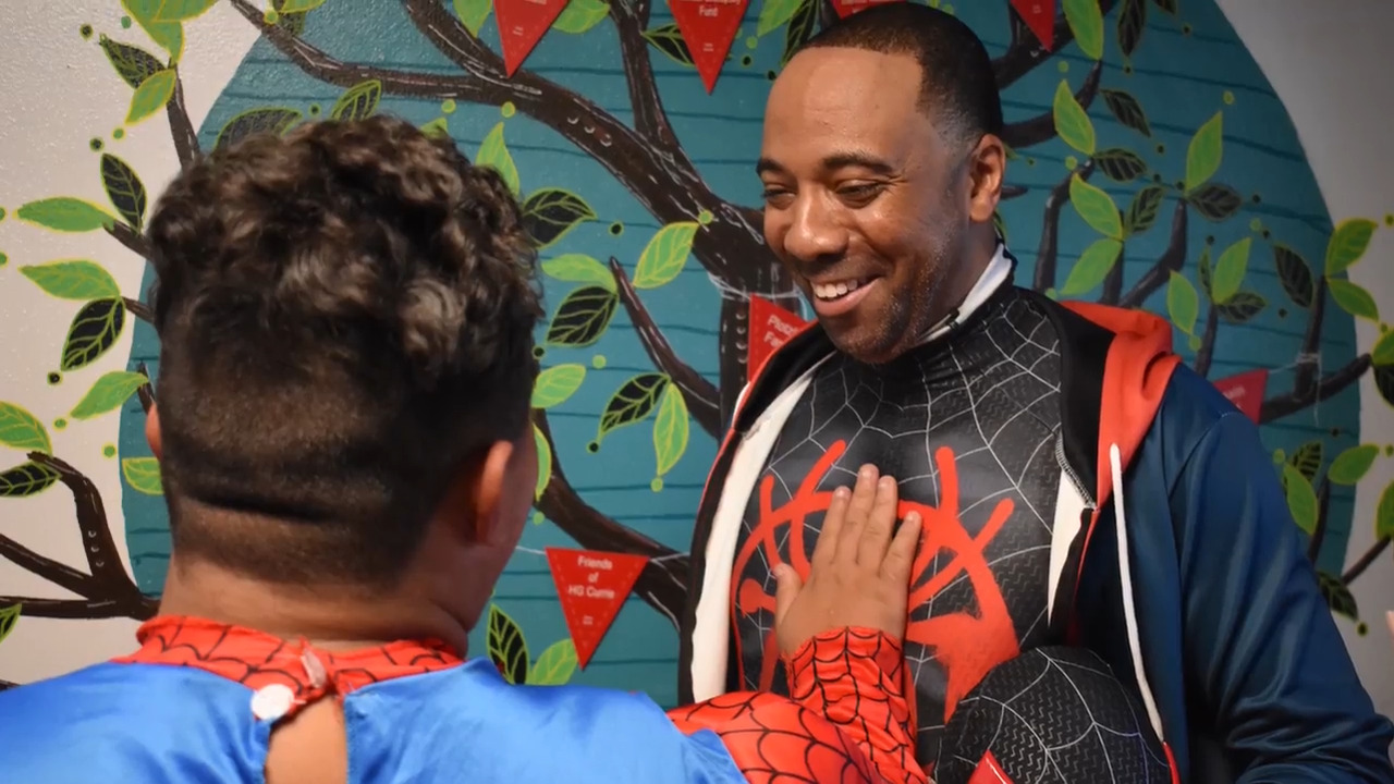 Superhero heart. Spidey swings into Modesto to help families in need