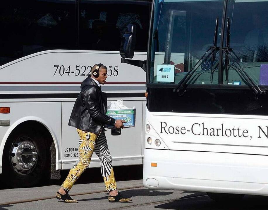 Who are you wearing, Cam Newton? Panthers quarterback heads to Super Bowl in style