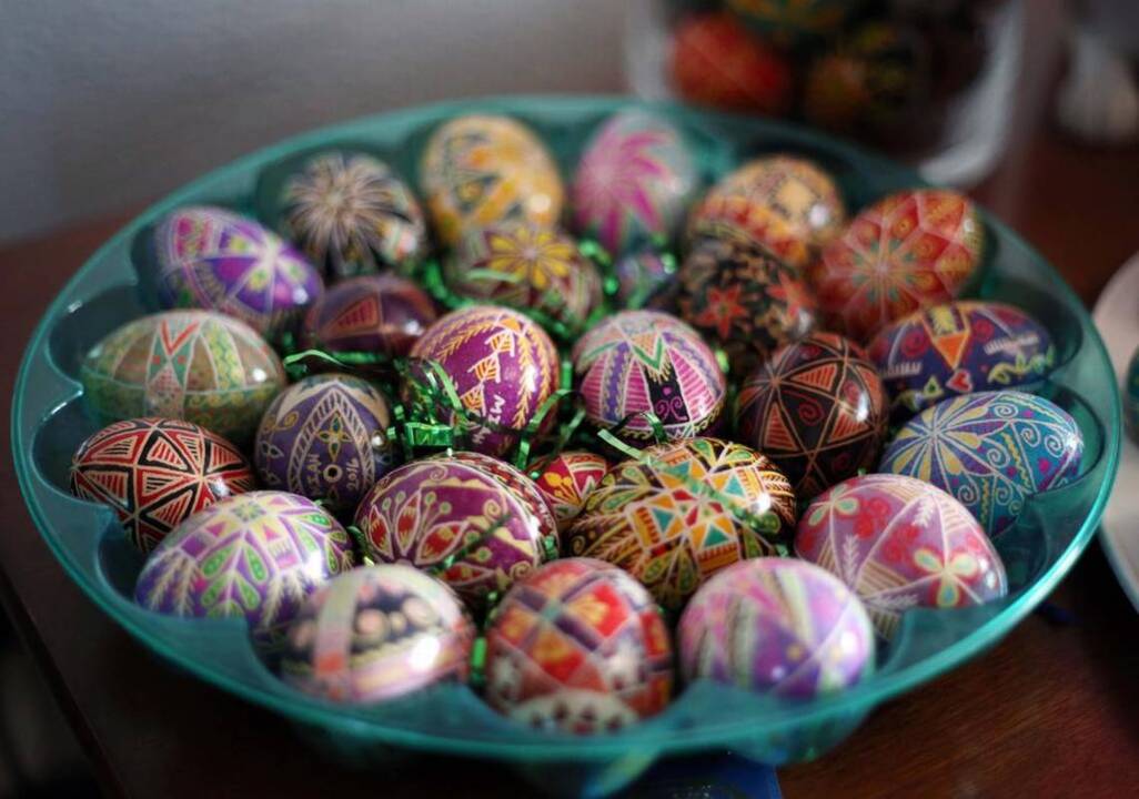 Painting intricate Ukrainian Easter eggs