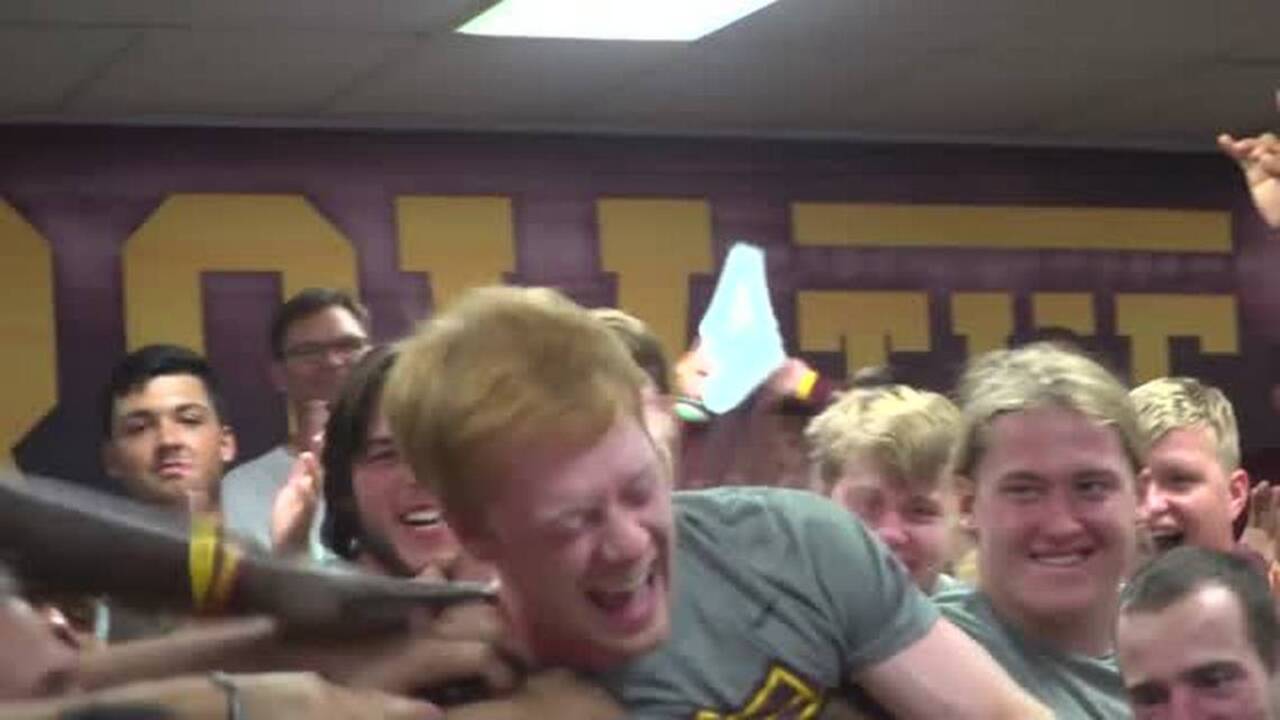 College football player learns of scholarship - in the very best way