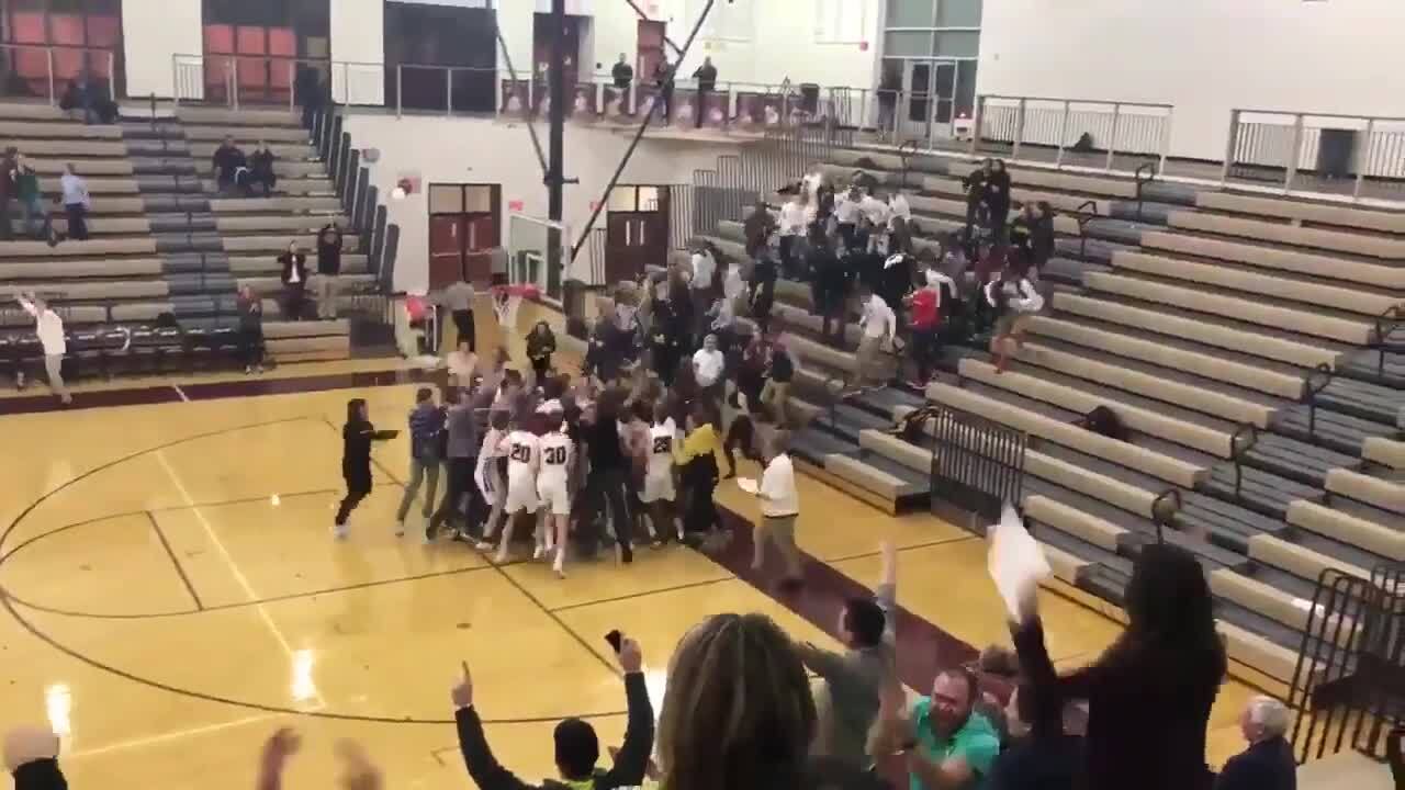 High School student seals win after nailing a nearly full-court buzzer beater