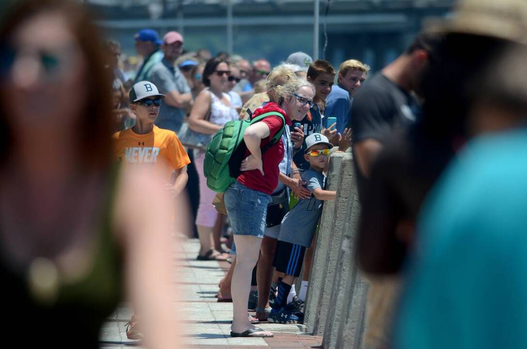 Spectators try to beat the heat while watching airplanes in Beaufort