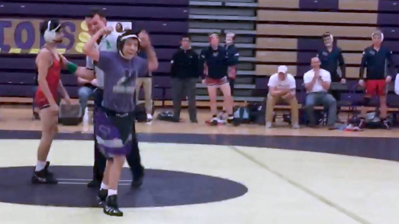 Holly Springs special needs student celebrates pin in 1st wrestling match