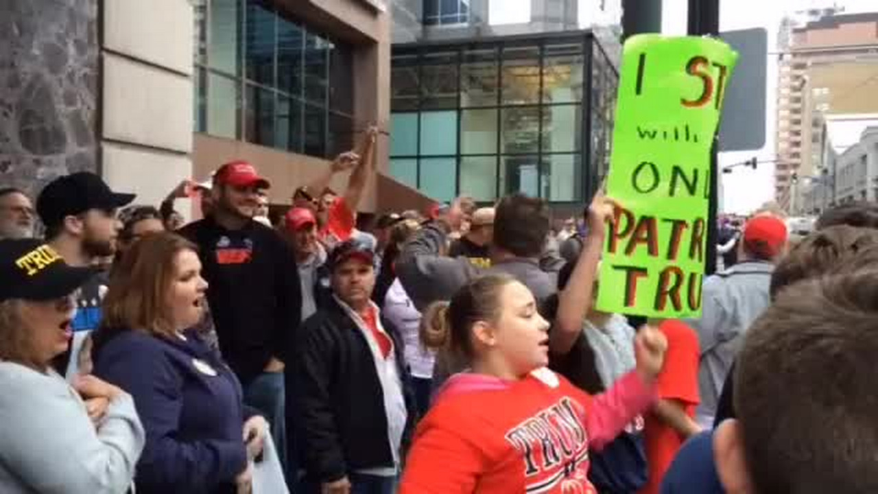 Trump supporters and protesters shout "U.S.A.!" at each other