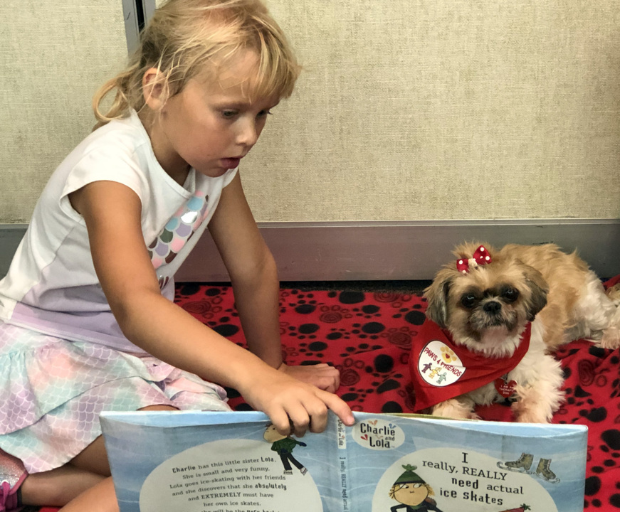 Has Oakdale Library gone to the dogs? No, but these canines help kids with reading anxiety