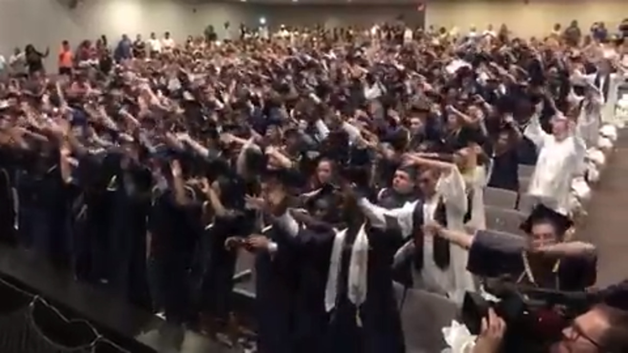 Watch NC teens' 'inspirational' graduation stunt: 'We can get along if we try'