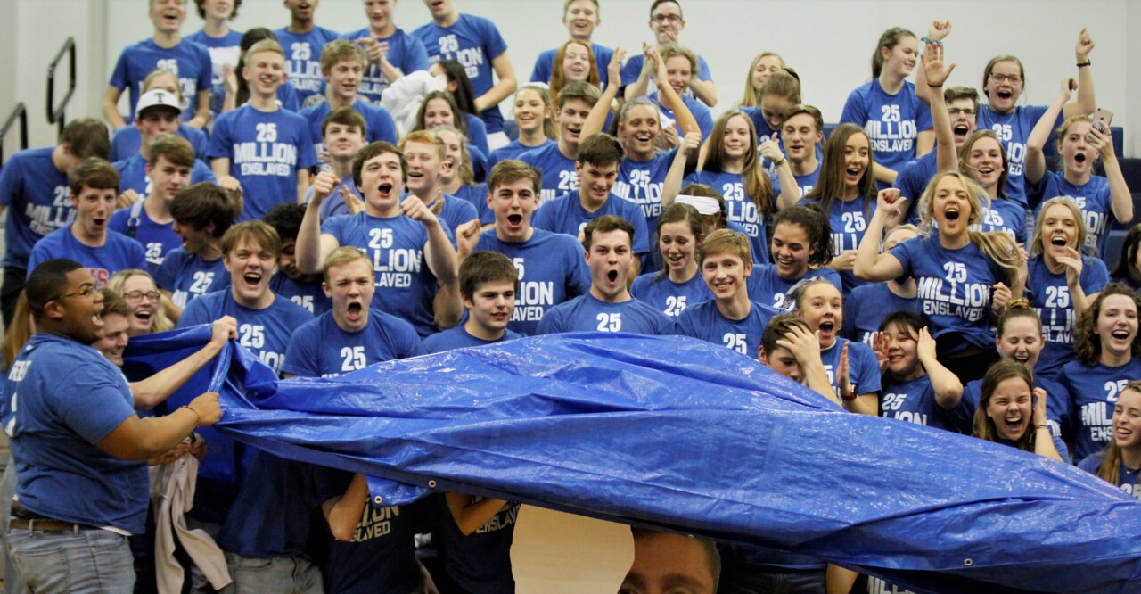Trinity Academy students pull the tarp back on human trafficking at basketball game