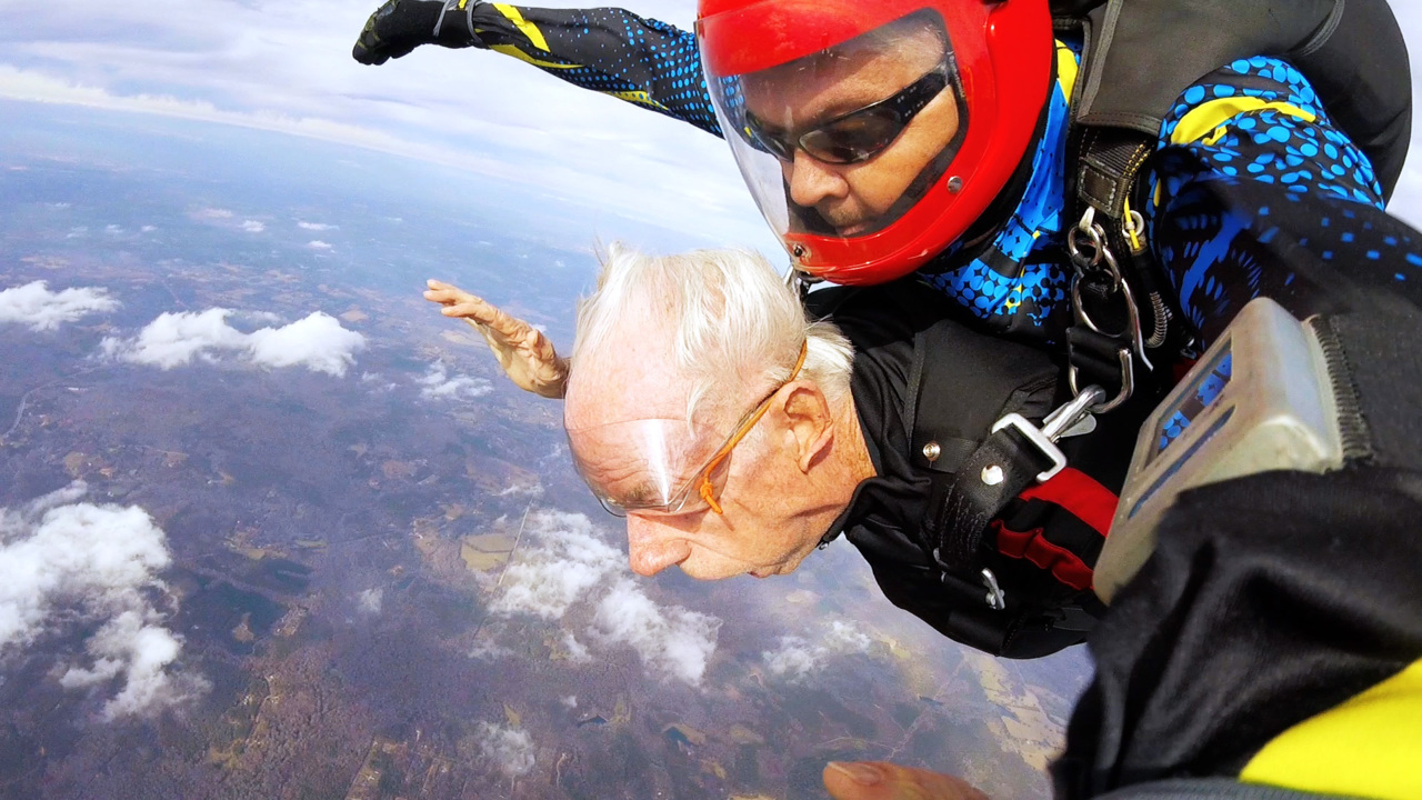 ‘Piece of cake, nothing to it.’ Watch 93-year-old  make parachute jump from 13,500 feet