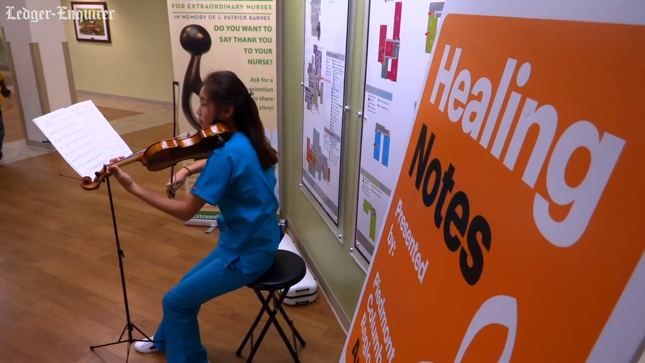 Student shares her violin-playing to help calm people at Columbus hospital