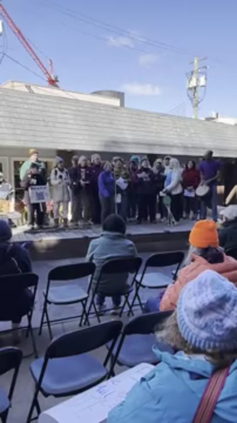 Community Members sing during No Kings event
