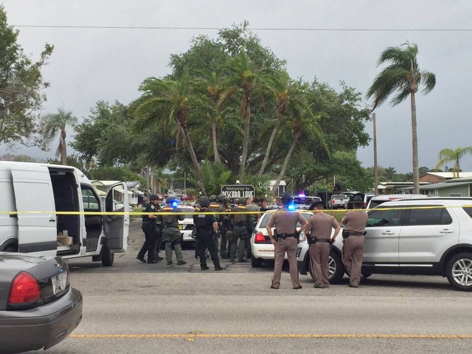 SWAT in standoff with man holding hostage