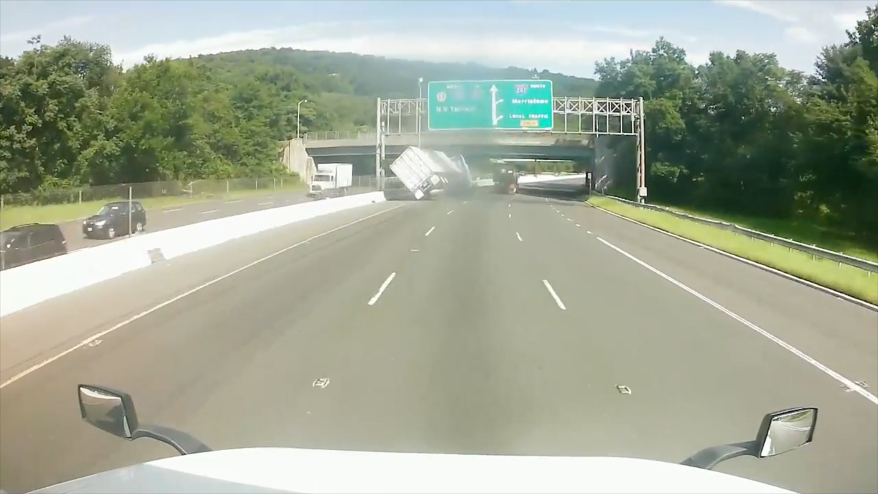 Candy-carrying tractor trailer takes a tumble on New Jersey road