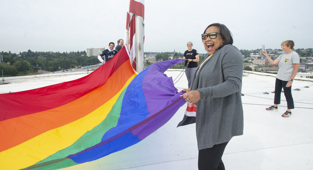 Rainbow of emotions stirred by first-ever raising of gay pride flag over Tacoma Dome