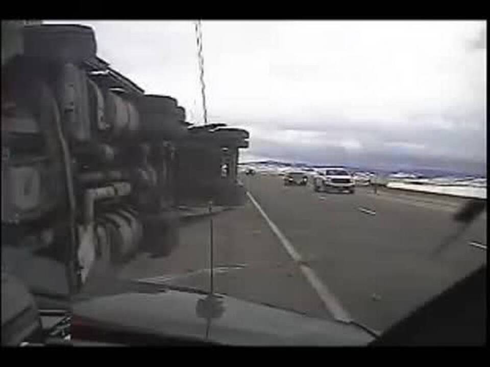 High winds topple semi, crushing patrol cruiser