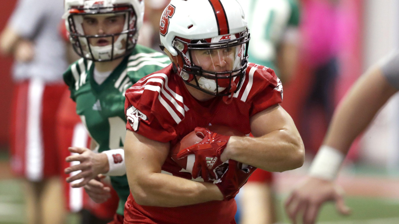 With his dad in the Middle East, this NC State RB used football to stay busy