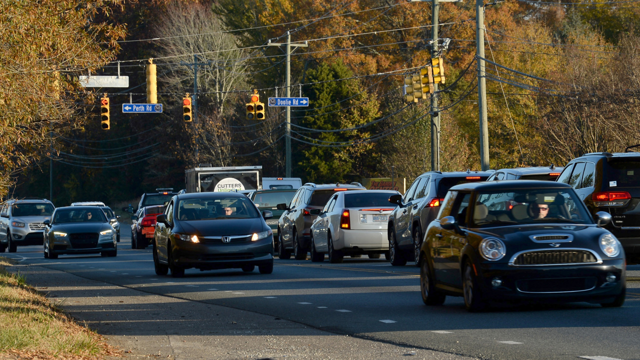 A two-lane road and rapid development have given N.C. 150 drivers 5-6 mile backups