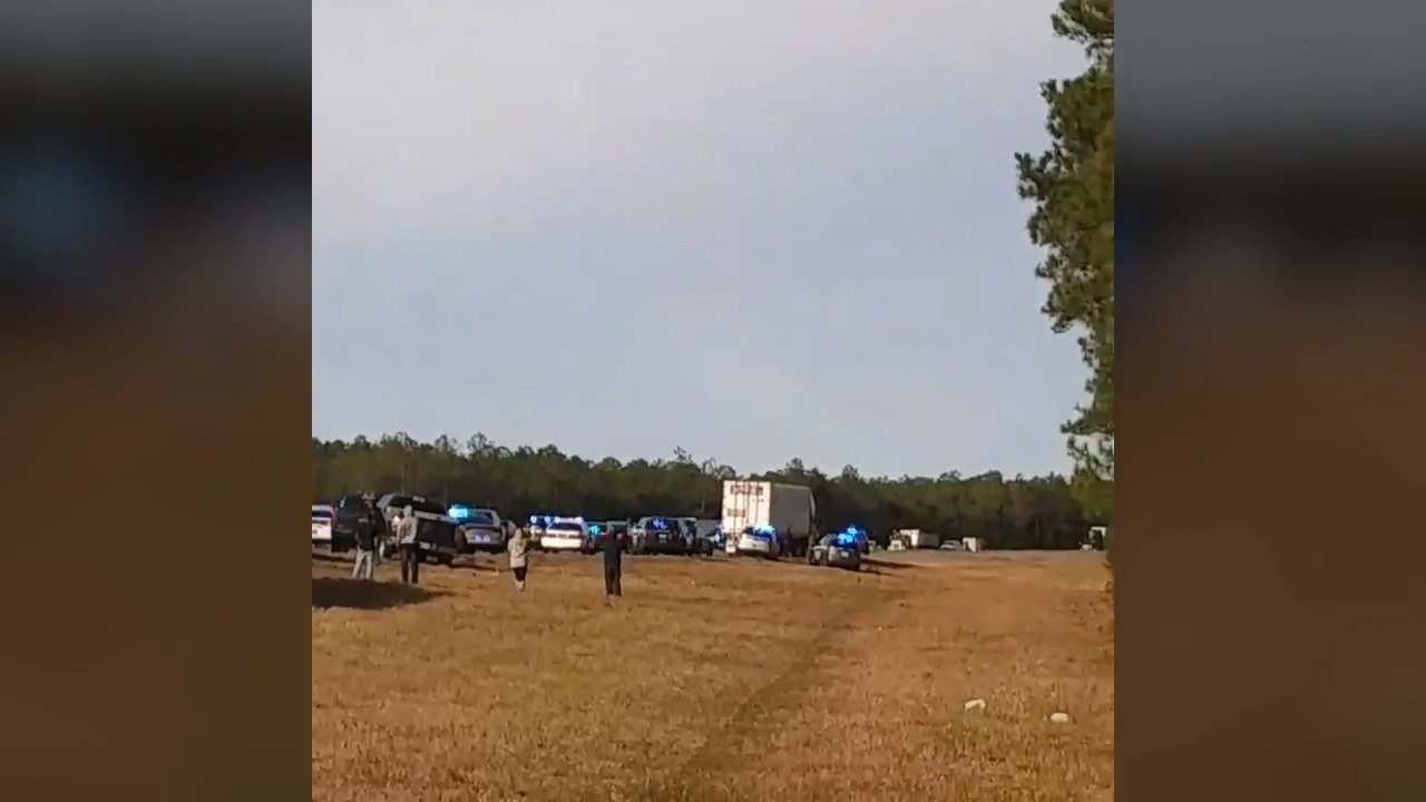 Standoff with machete-wielding truck driver started with road rage at ambulance, officials say