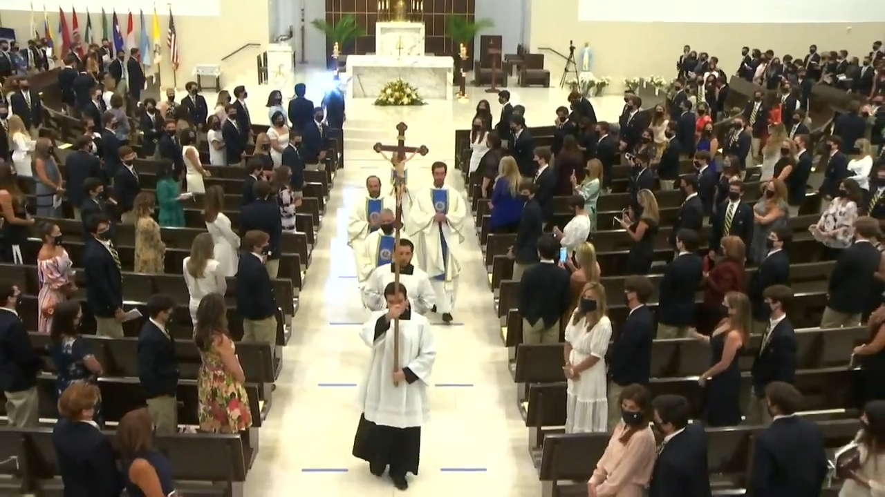 Belen priest asked graduates to take off masks to sing. That was edited out of video.