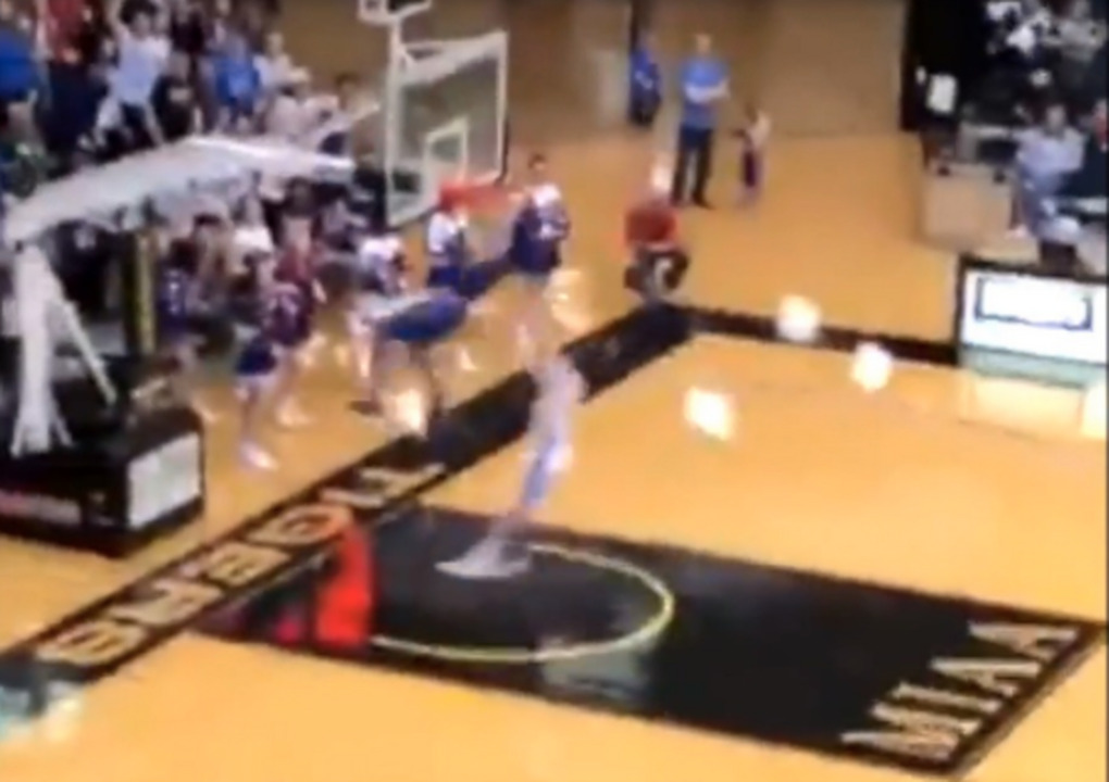 Ouch! Player is shoved into goal after dunk