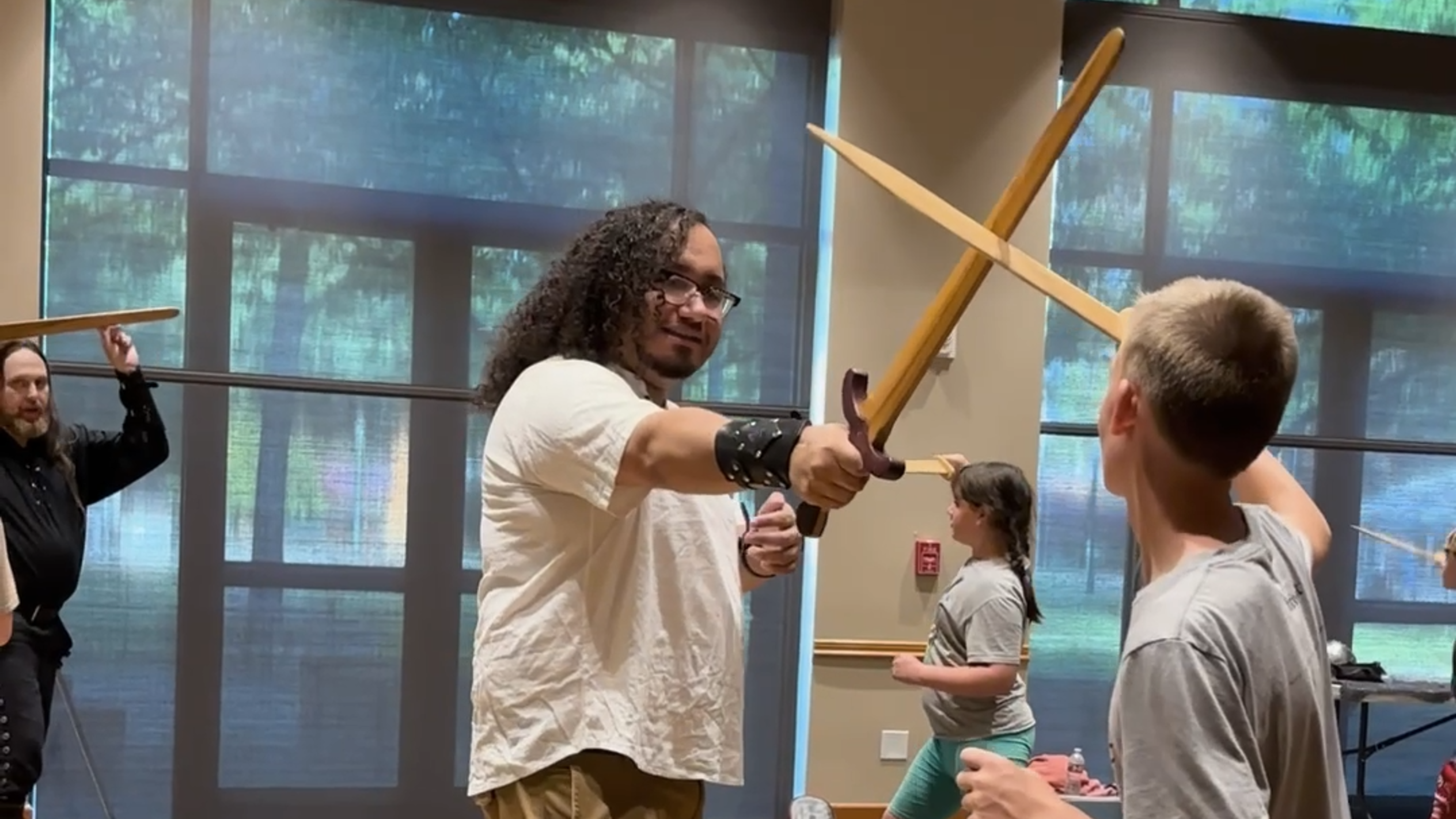 Instructors in the Puyallup Public Library instructors teach medieval combat