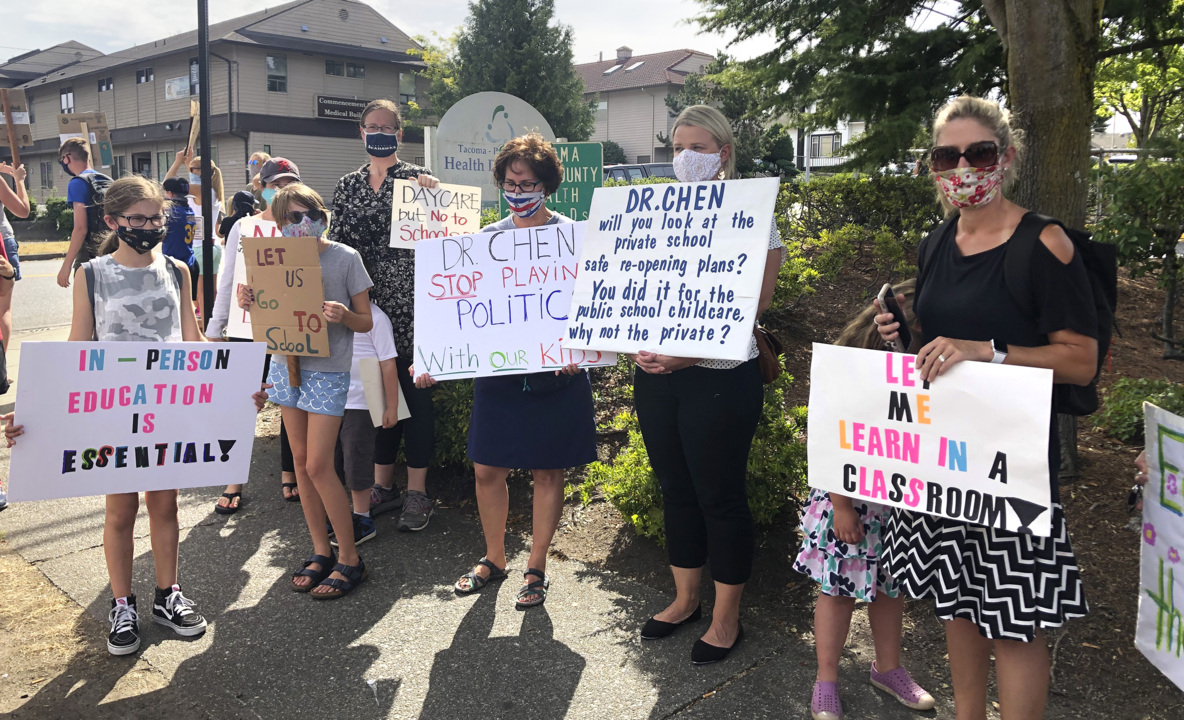 Families who want schools reopened protest outside Pierce County health department