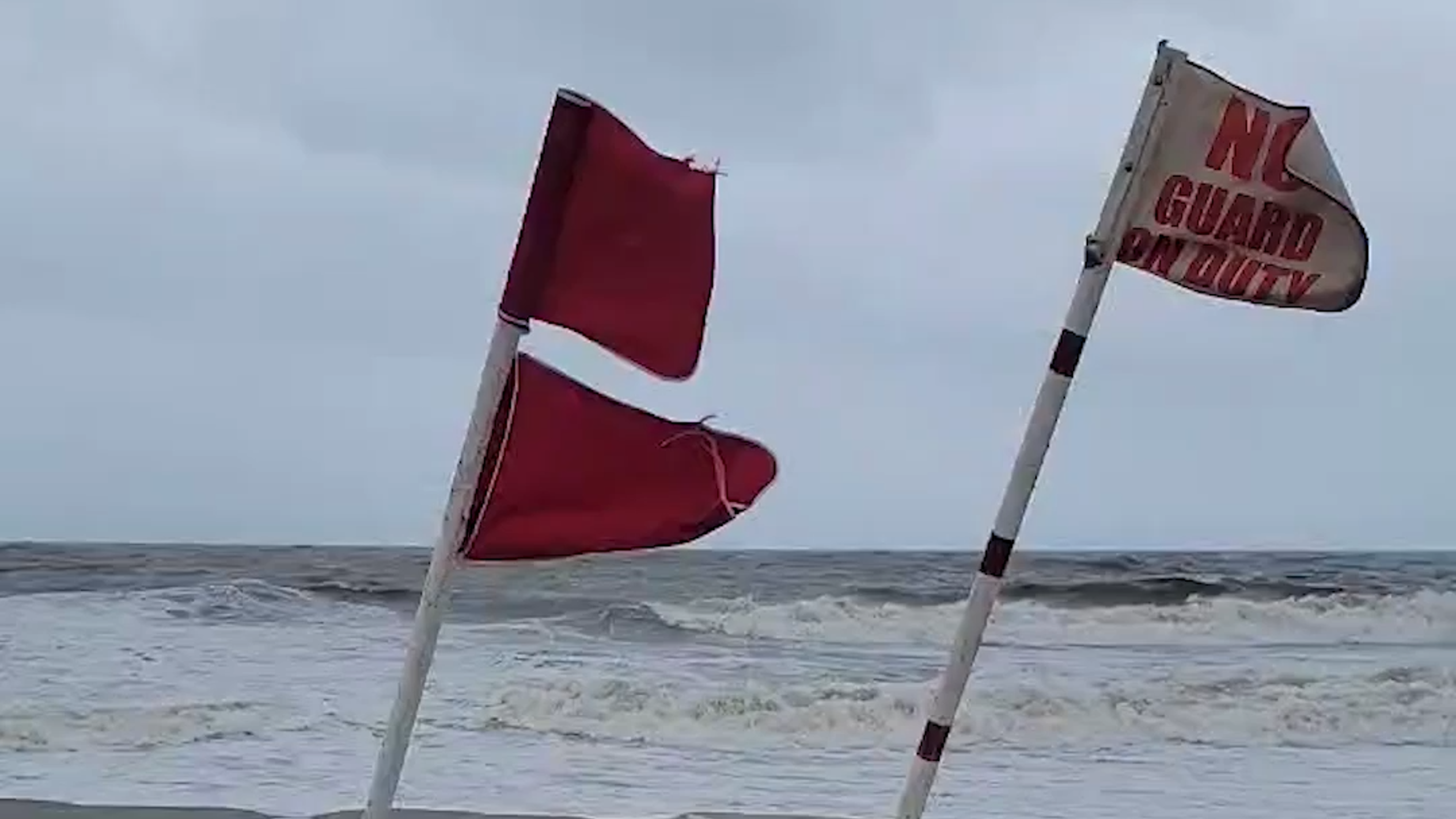 Beach red flags warn visitors to stay out of the water