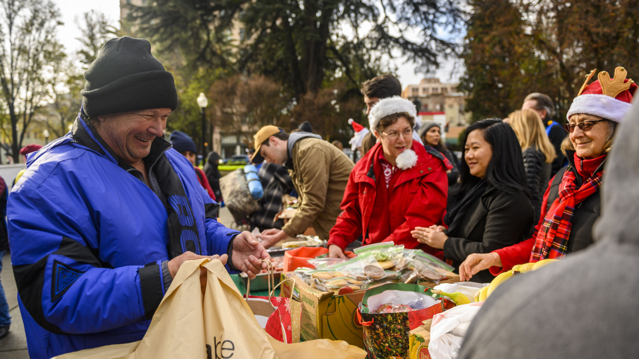 ‘They’re just smiles’: Volunteers donate clothes, hot food to Sacramento’s homeless