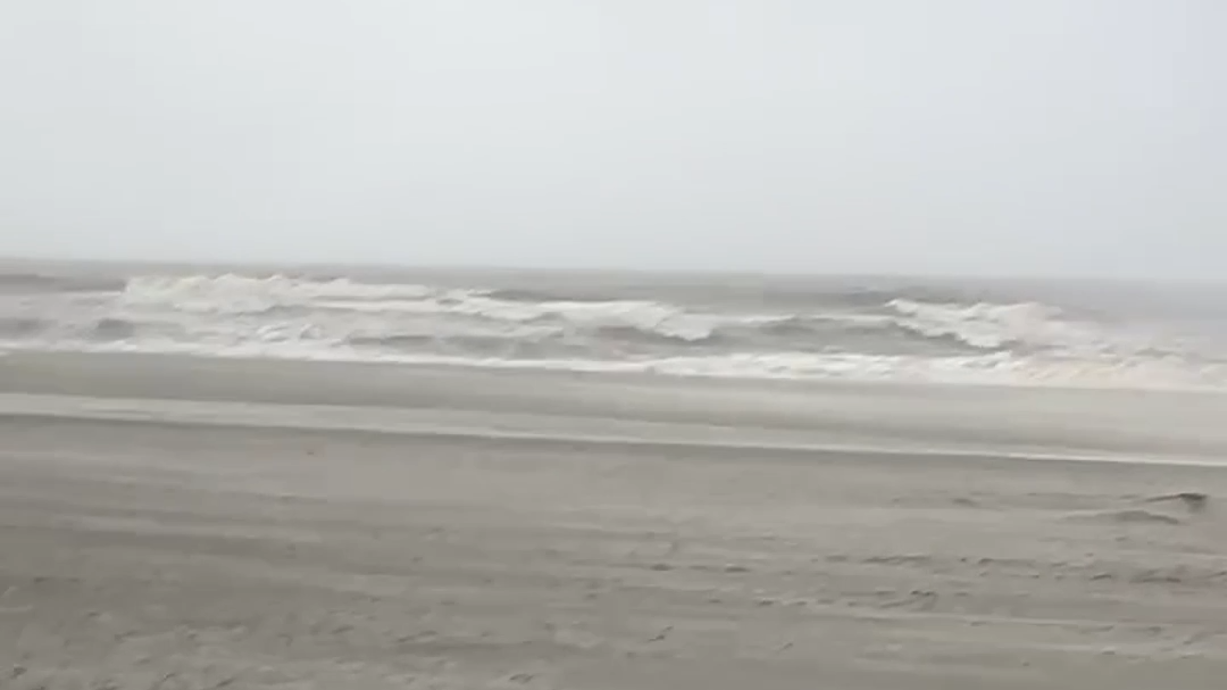 Bands of wind and rain lash beach near Apache Pier in Horry County, SC