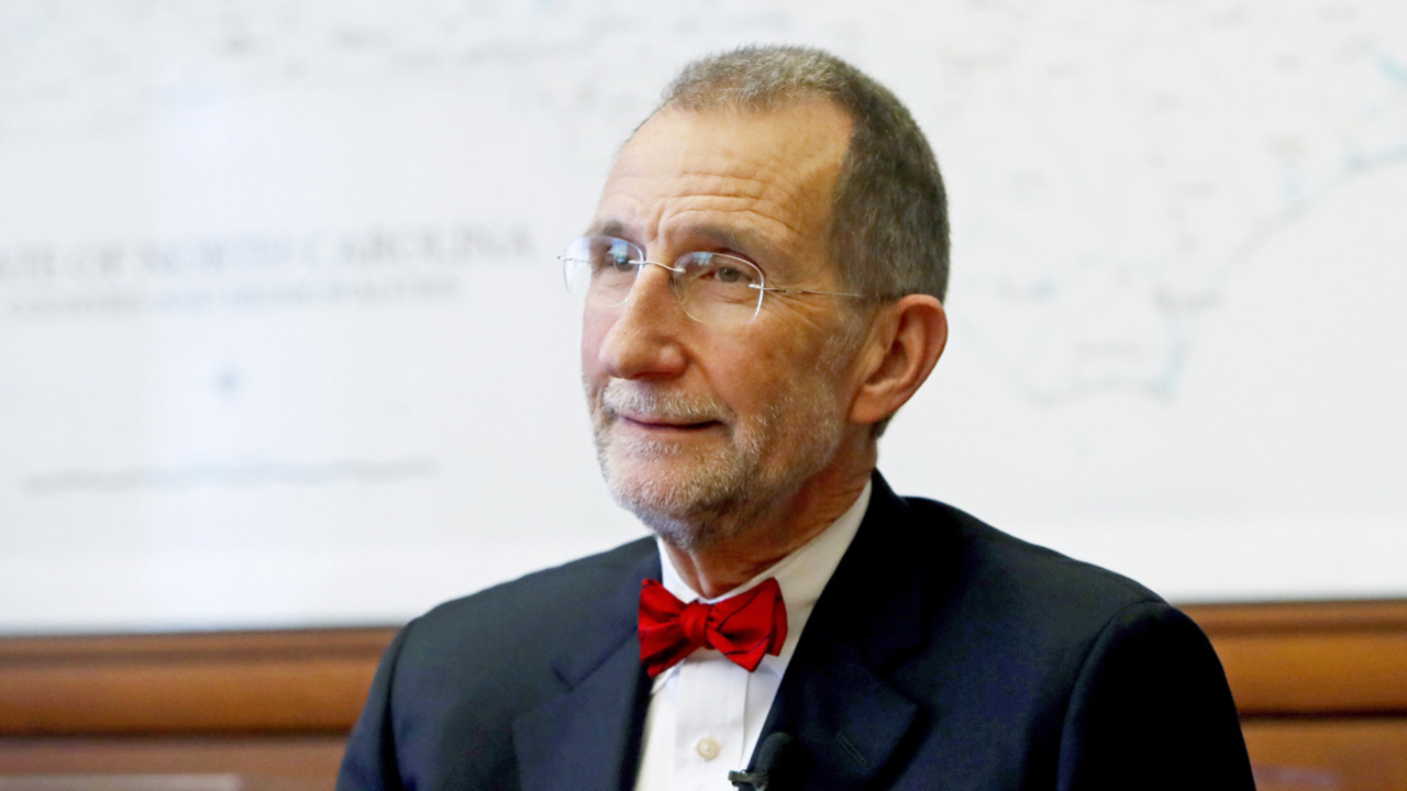 Why did UNC Health Care want to merge with Charlotte’s Atrium Health?
