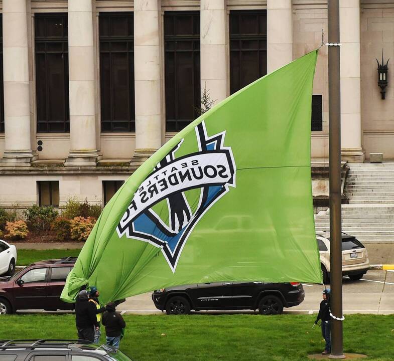 Sounders flag flies over the Capitol