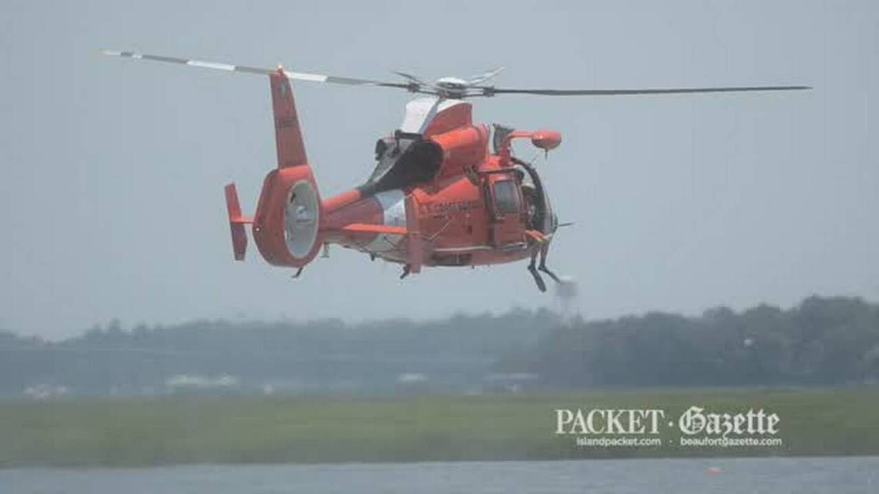 U.S. Coast Guard diver jumps from helicopter at Beaufort Water Festival air show